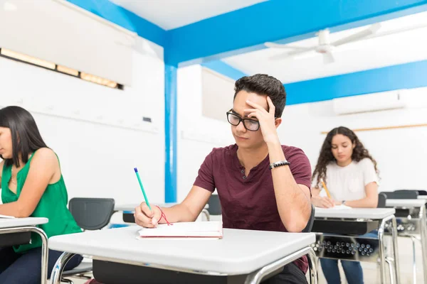 Confused Teenager Solving Algebra Book While Sitting Classroom — Stock Photo, Image