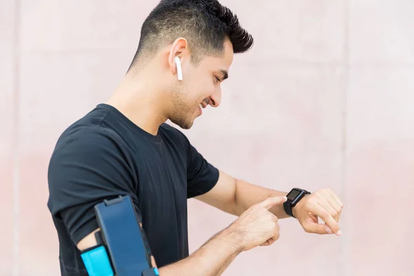 Smiling Latin Athlete Checking Fitness App Smartwatch — Stock Photo, Image