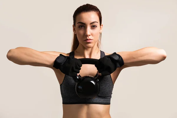 Caucasian Young Sportswoman Training Kettlebell Colored Background — Stock Photo, Image