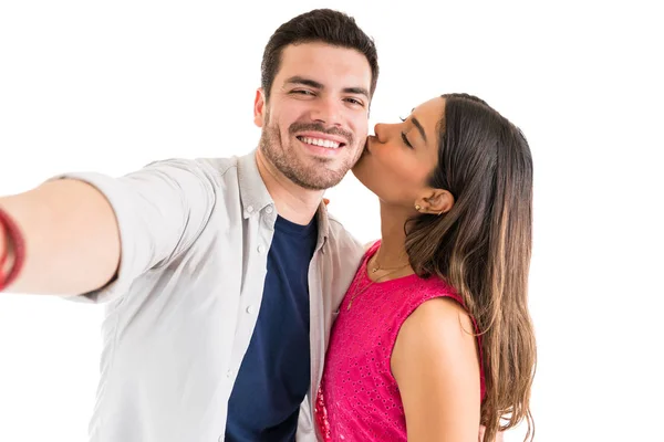 Beautiful Woman Kissing Cheerful Handsome Boyfriend While Taking Selfie Him — Stock Photo, Image