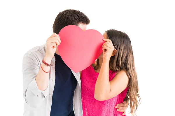 Young Couple Love Kissing While Hiding Face Big Red Paper — Stock Photo, Image