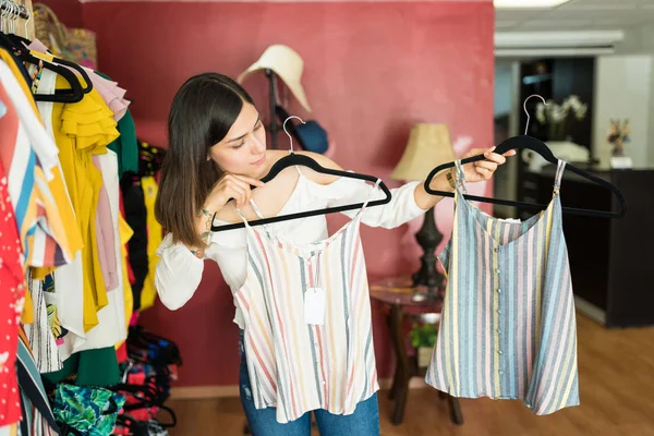 Female Customer Comparing Striped Tops Hanging Coathangers Shopping Mall — Stock Photo, Image