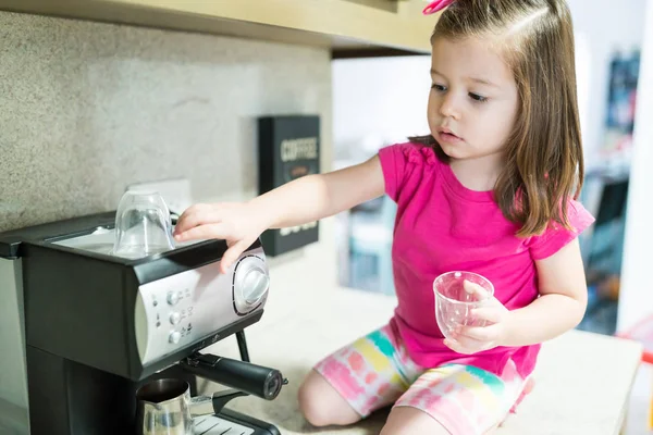 Toddler Using Coffee Maker While Sitting Kitchen Counter Home — Stock Photo, Image