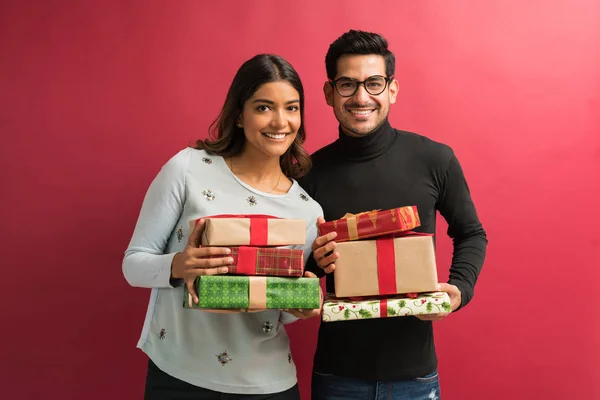 Smiling Young Hispanic Couple Standing Gift Boxes While Standing Studio — Stock Photo, Image