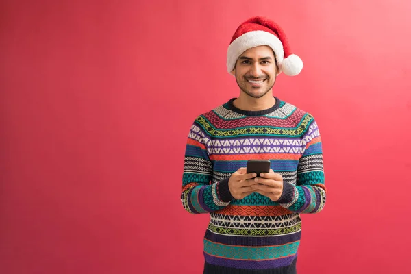 Handsome Hispanic Male Surfing Internet Mobile While Making Eye Contact — Stock Photo, Image