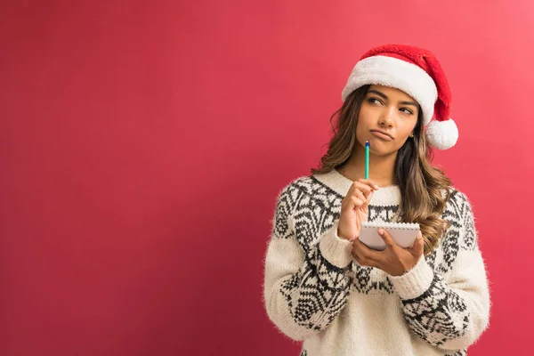 Young Female Hispanic Brunette Looking Away While Holding Notepad Pencil — Stock Photo, Image