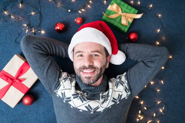 Handsome Smiling Mid Adult Man Wearing Santa Hat Lying Carpet — Stock Photo, Image