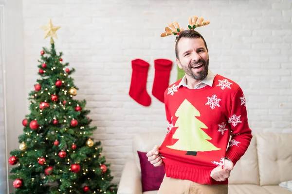 Cheerful Mid Adult Man Showing His Red Ugly Sweaters Christmas — Stock Photo, Image
