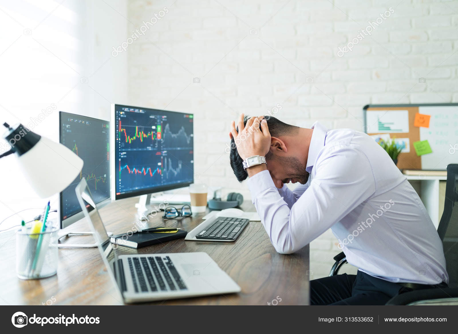 Side View Stressed Young Broker Sitting Head Hands Desk While