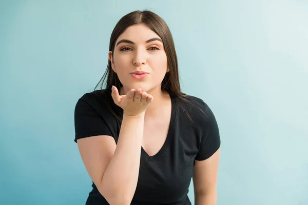 Portrait Good Looking Female Blowing Kiss While Standing Studio — Stock Photo, Image