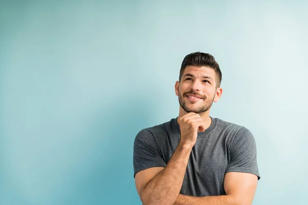 Thoughtful Good Looking Young Man Looking While Smiling Studio — Stock Photo, Image