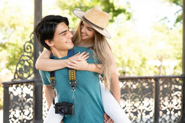 Happy Handsome Hispanic Young Man Piggybacking Girlfriend While Traveling Together — Stock Photo, Image