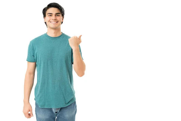 Smiling Handsome Young Man Pointing Thumb Copy Space White Background — Stock Photo, Image