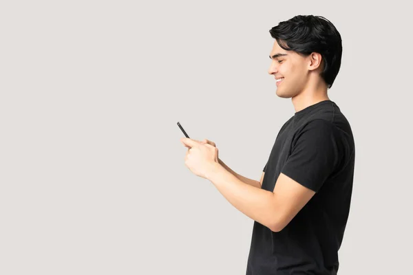 Side View Smiling Young Man Text Messaging Smartphone While Standing — Stock Photo, Image