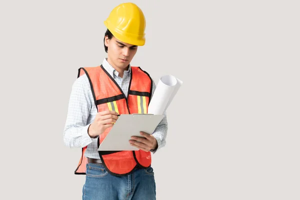 Young Latin Male Civil Engineer Reading Contract While Standing Gray — Stock Photo, Image