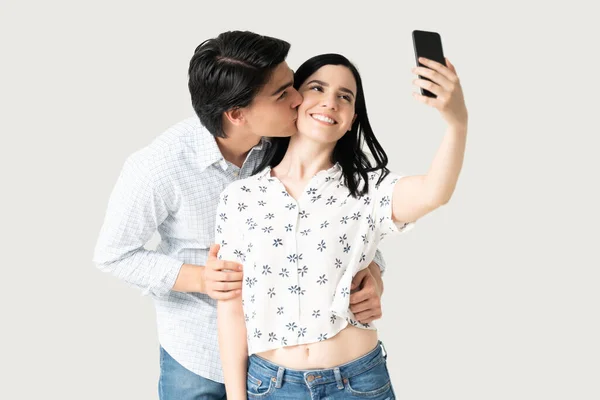 Young Man Kissing Happy Girlfriend Taking Selfie Mobile Phone — Stock Photo, Image