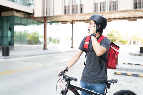 Young Delivery Man Searching Address While Talking Mobile Phone Street — Stock Photo, Image