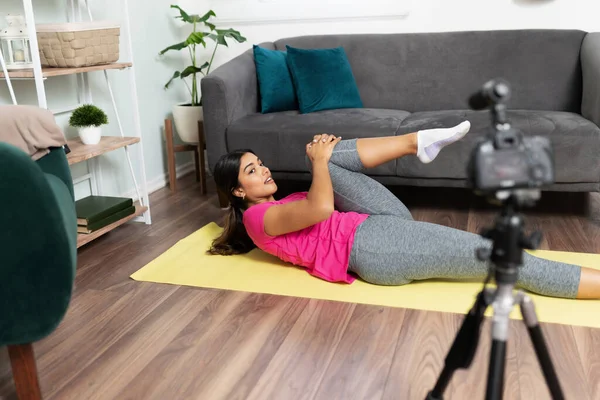 Health and fitness video blogger sharing a workout routine and some advice with some of her social media followers