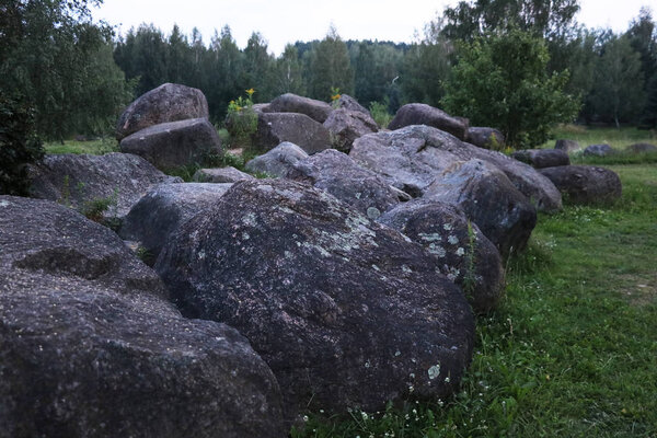 Landscape design with big black stones in the park.