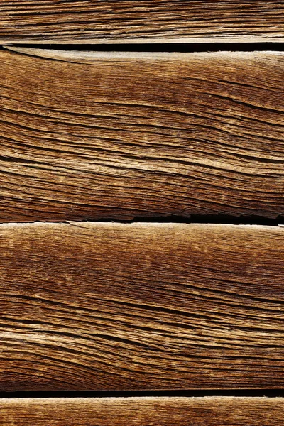 Eski doğal desenli koyu ahşap arkaplan yüzeyi.