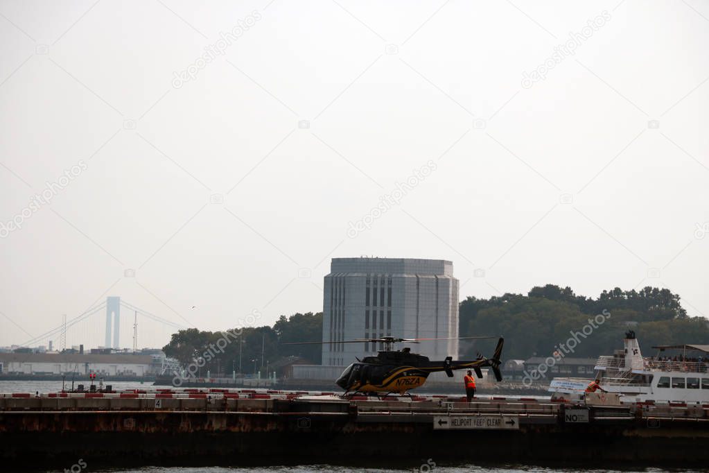 New York, USA - September 2, 2018: helicopter landing pad near the brooklyn bridge.