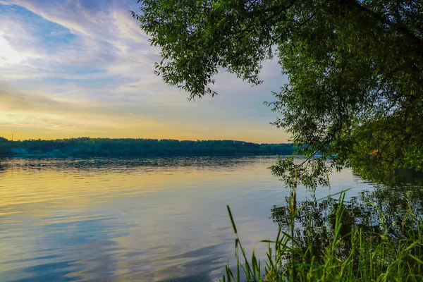 Sunset river sky clouds landscape. River sunset horizon view. Sunset river landscape. River sunset view.