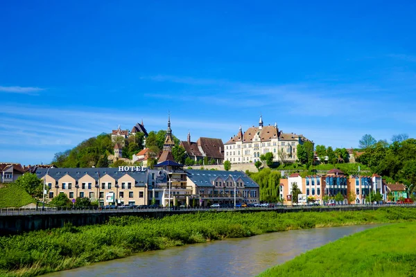 Sighisoara, Romania, May 11, 2019: Panoramic view over the cityscape and roof architecture in Sighisoara, medieval town of Transylvania. Stock Image