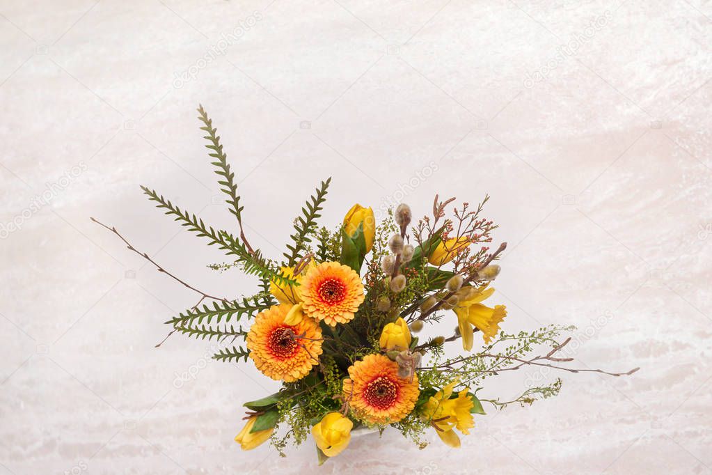 A bouquet of spring flowers on a white background.