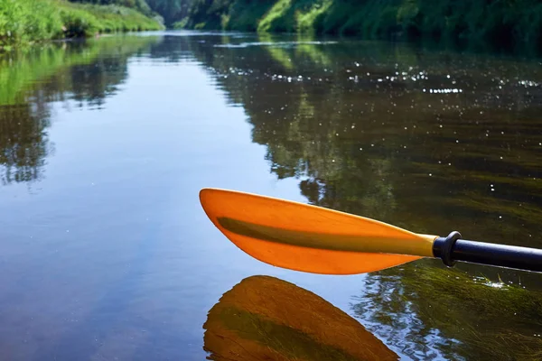 Yellow paddle close up.Yellow paddle over the water. — Stock Photo, Image