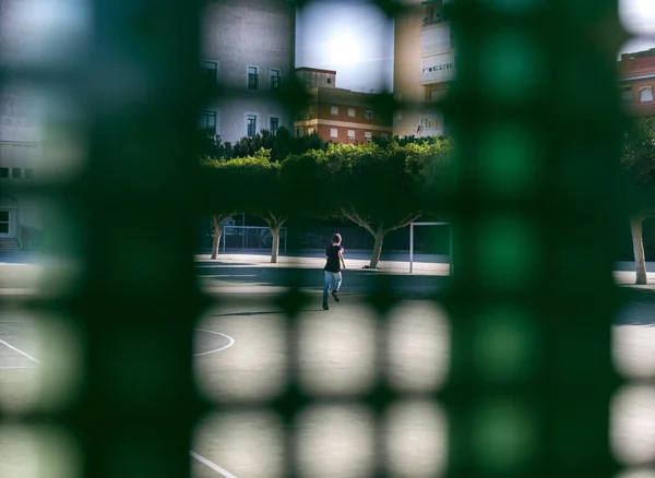 A little boy inside school at sports court — Stock Photo, Image