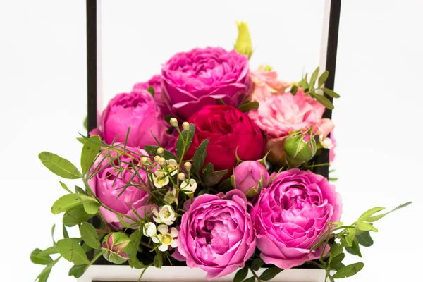 A bouquet of flowers in a gift box box, Booker of roses for mother\'s day. Roses in a gift box. Flowers on March 8. Happy women\'s day. Bouquet for a birthday.