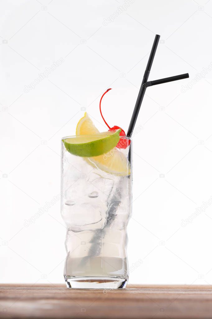 Cold alcohol cocktail with cherry and lemon