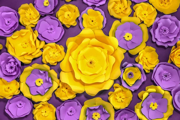 Many beautiful handmade paper flowers, yellow and purple