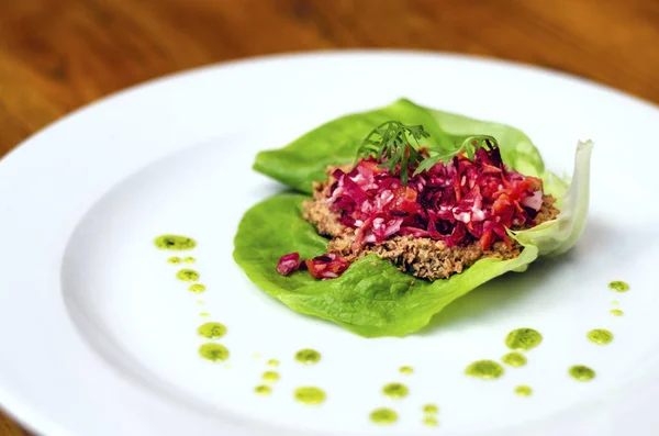 Raw vegan meal - lettuce tacos with taco nut meat and mixed salad