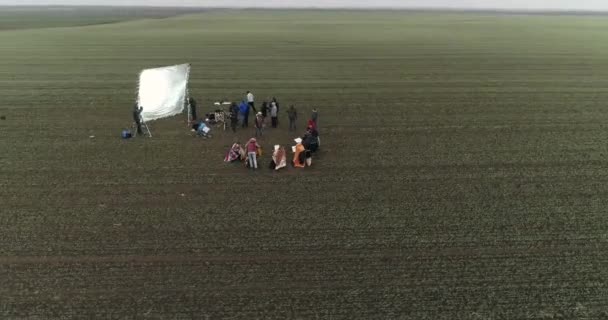 Camera Orbits Film Crew Setting Scene Field Winter Cloudy — Stock Video