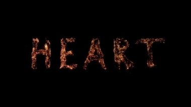 Word Heart siyah arka planda yanma