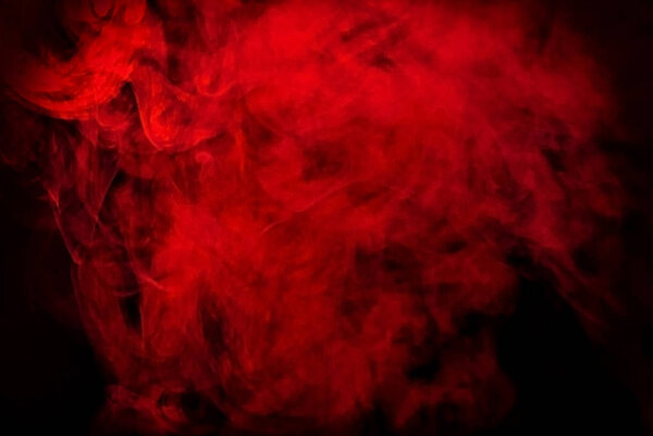 Red smoke on black. Texture for wallpaper and background.