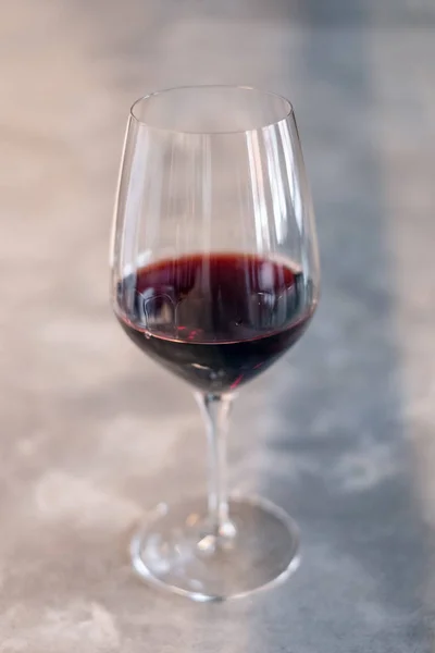 Glass of red wine on bar top