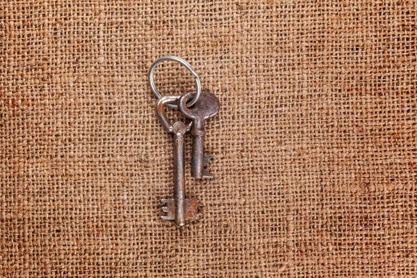 Two Old Rusty Keys Rustic Sackcloth Background — Stock Photo, Image