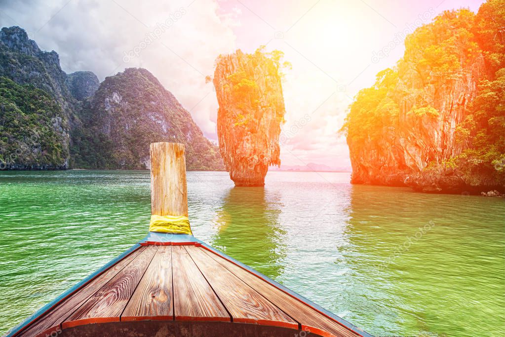 Boat trip to tropical islands from Phuket, Krabi in Thailand. Green mountains and blue water lagoon 