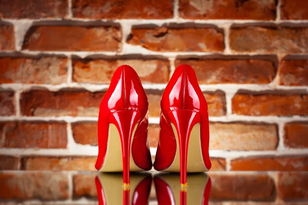 Red High Heels Red Brick Wall Background — Stock Photo, Image