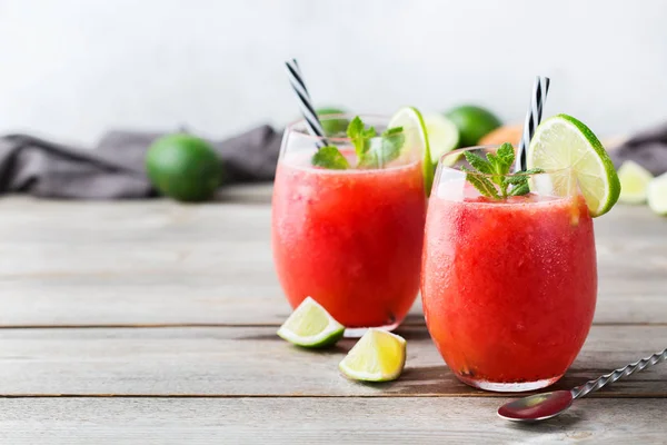 Food and drink, party holiday concept. Alcohol beverage cold cool red watermelon cocktail drink on a modern table for summer days. Copy space background