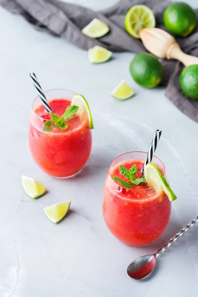 Food and drink, party holiday concept. Alcohol beverage cold cool red watermelon cocktail drink on a modern table for summer days
