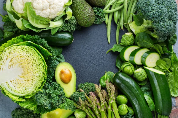 Assortment of organic green vegetables, clean eating vegan concept