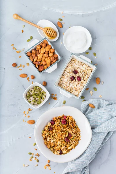 Homemade granola muesli with ingredients, healthy food for breakfast