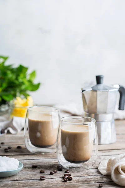 Keto, ketogenic bulletproof coffee with coconut oil and ghee butter