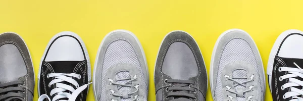 Set of fashionable male shoes on yellow background — Stock Photo, Image