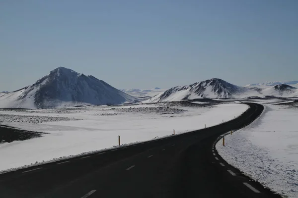 Road in Iceland. Landscape and road in winter, road trip on the country at Iceland. Beautifull nature of Iceland. Epic and majestic landsacapes. Route Number One (Ring Road).