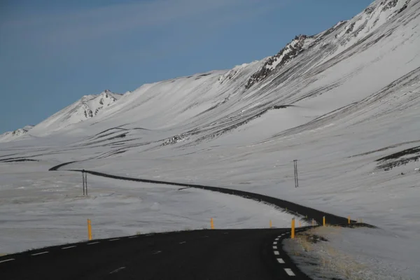 Road in Iceland. Landscape and road in winter, road trip on the country at Iceland. Beautifull nature of Iceland. Epic and majestic landsacapes. Route Number One (Ring Road).