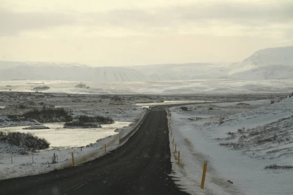 Road in Iceland. Landscape and road in winter, road trip on the country at Iceland. Beautifull nature of Iceland. Epic and majestic landsacapes. Route Number One (Ring Road).